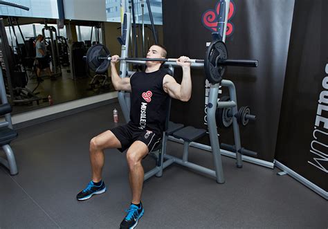 The Standing Barbell Shoulder Press is a compound movement which allows you to target the deltoids with moderate to heavy loads. Using the proper form is cru...